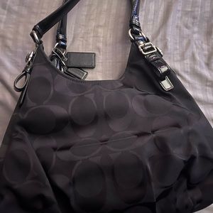 Authentic Black coach bag. Has 3 inside pockets, Hardly used, in good condition